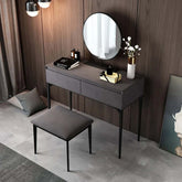 Contemporary gray makeup vanity set with plush velvet dressing area, mirror, and comfortable stool